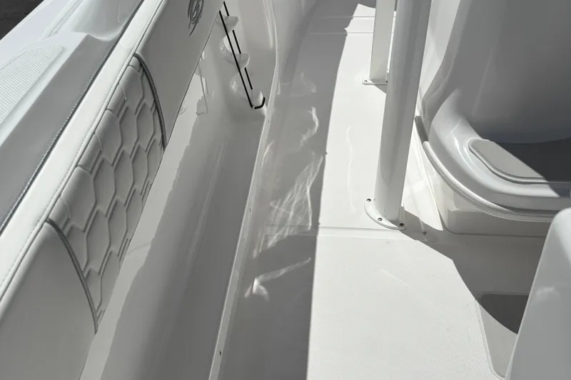 Slide: The Image of 2026 Glasstream 280 Pro-XS boat interior with sleek white seating and flooring. - 18