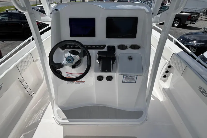 Slide: The Image of 2026 Glasstream 280 Pro-XS boat dashboard with steering wheel and dual displays. - 20