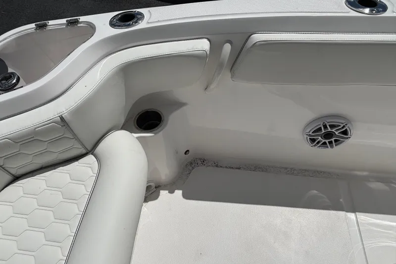 Slide: The Image of 2026 Glasstream 280 Pro-XS boat interior with white seating and speaker detail. - 23