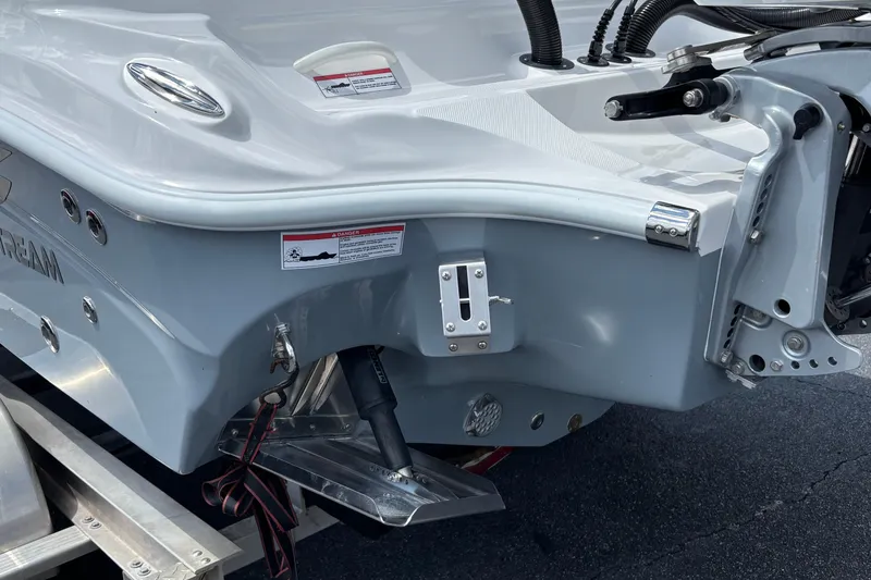 Slide: The Image of 2026 Glasstream 280 Pro-XS boat stern detail with hydraulic components and warning labels. - 26