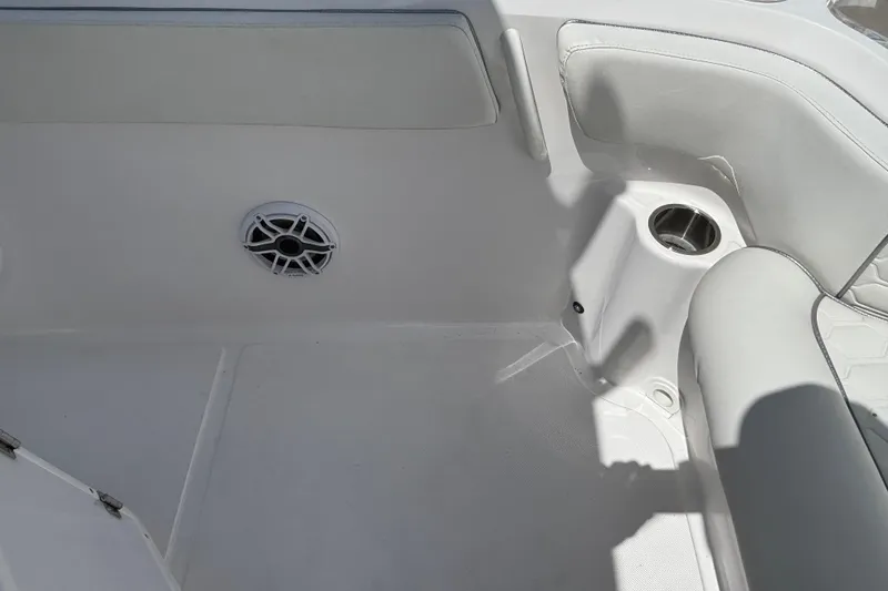 Slide: The Image of Interior of 2026 Glasstream 280 Pro-XS boat with speaker and cup holder. - 27