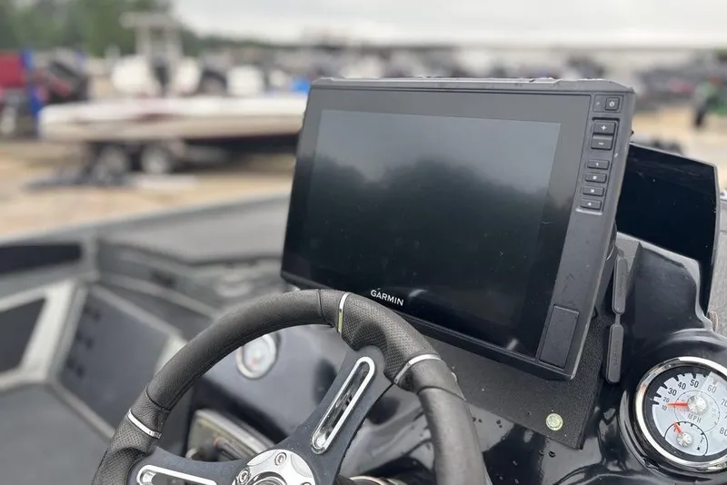 Slide: The Image of Steering wheel and Garmin display on 2019 Nitro Z20 boat dashboard. - 12