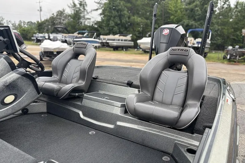 Slide: The Image of 2019 Nitro Z20 boat interior with gray seats and steering wheel. - 13
