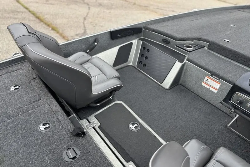 Slide: The Image of 2019 Nitro Z20 boat interior with gray seating and storage compartments. - 15