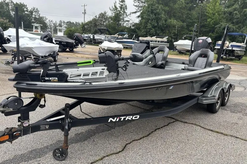 Slide: The Image of 2019 Nitro Z20 fishing boat on trailer, equipped with Minn Kota Ultrex motor. - 4