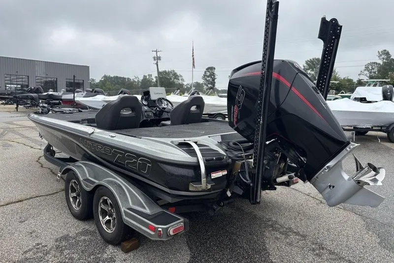Slide: The Image of 2019 Nitro Z20 boat with powerful outboard motor, parked on a trailer. - 6