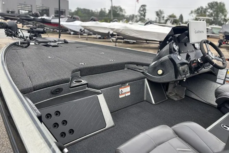 Slide: The Image of 2019 Nitro Z20 boat interior with Garmin system and steering wheel, showcasing spacious deck layout. - 8