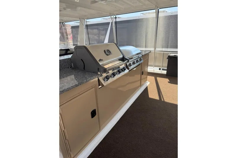 Slide: The Image of Outdoor kitchen with grill on Sumerset Relentless Multiple Shares 2025 houseboat. - 11