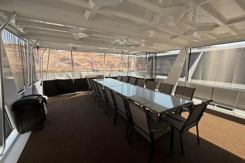 Slide: The Image of Spacious dining area on 2025 Sumerset Relentless Multiple Shares houseboat with scenic views. - 16