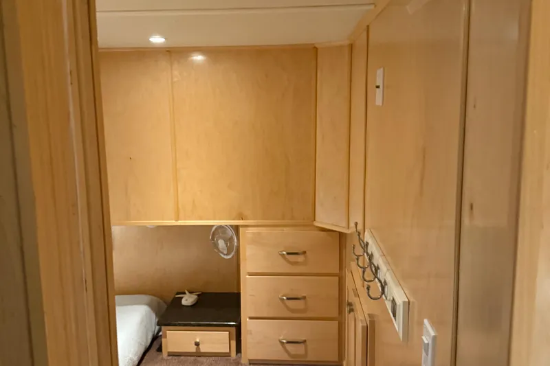 Slide: The Image of Cozy cabin interior of 2025 Sumerset Relentless Multiple Shares with wooden cabinetry and bed. - 27
