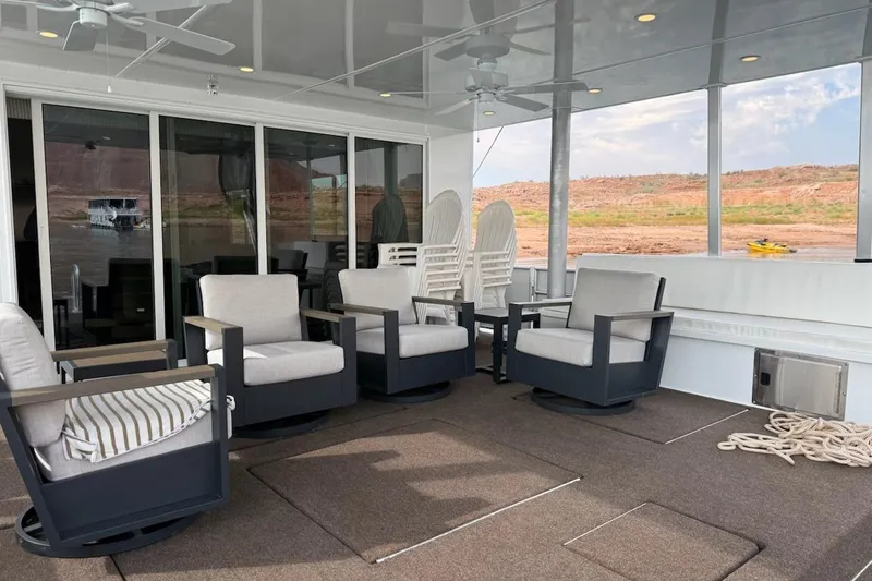 Slide: The Image of Luxurious Sumerset Relentless Multiple Shares 2025 houseboat deck with comfortable seating and scenic views. - 33
