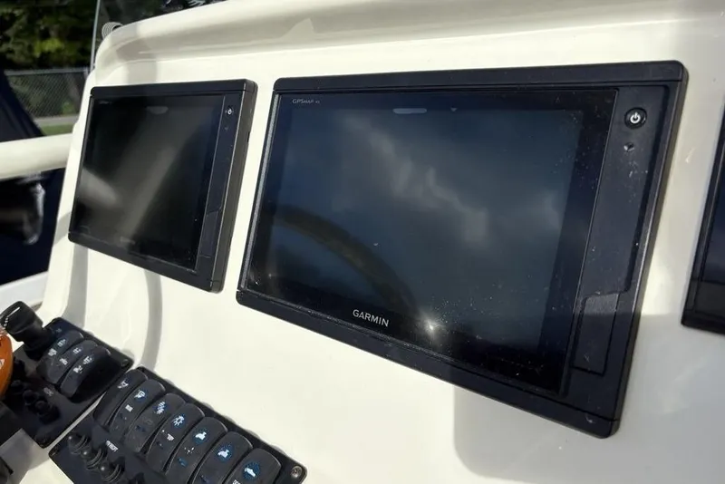 Slide: The Image of Dashboard of 2021 Stingray 236CC with Garmin displays and control panel. - 22