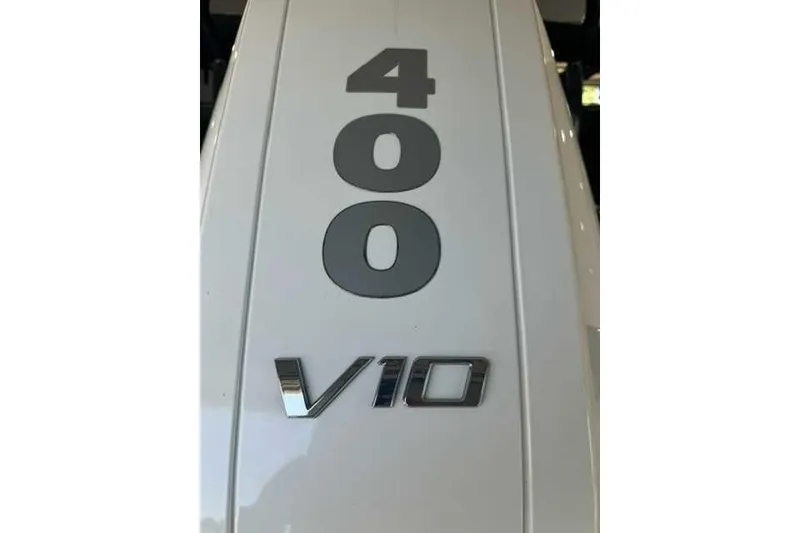 Slide: The Image of Close-up of 400 V10 engine badge on 2024 Premier 250 Intrigue RL. - 3