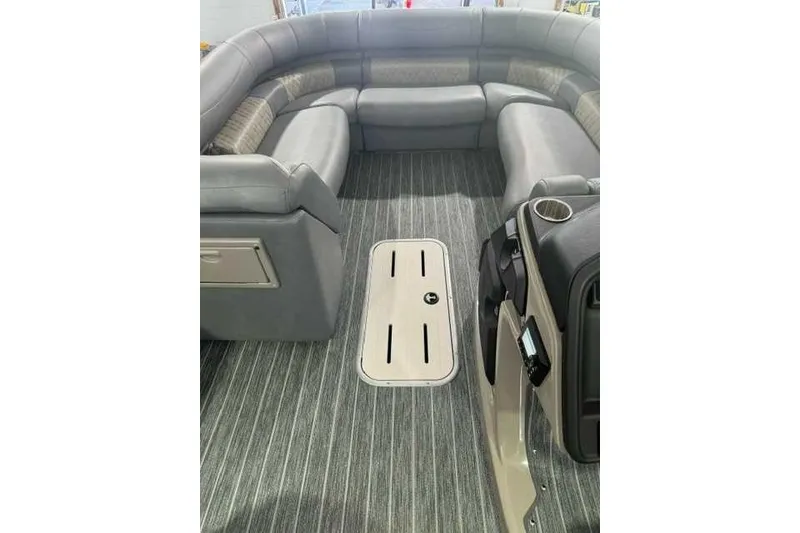 Slide: The Image of Luxurious interior of 2024 Premier 250 Intrigue RL pontoon boat with plush seating. - 7