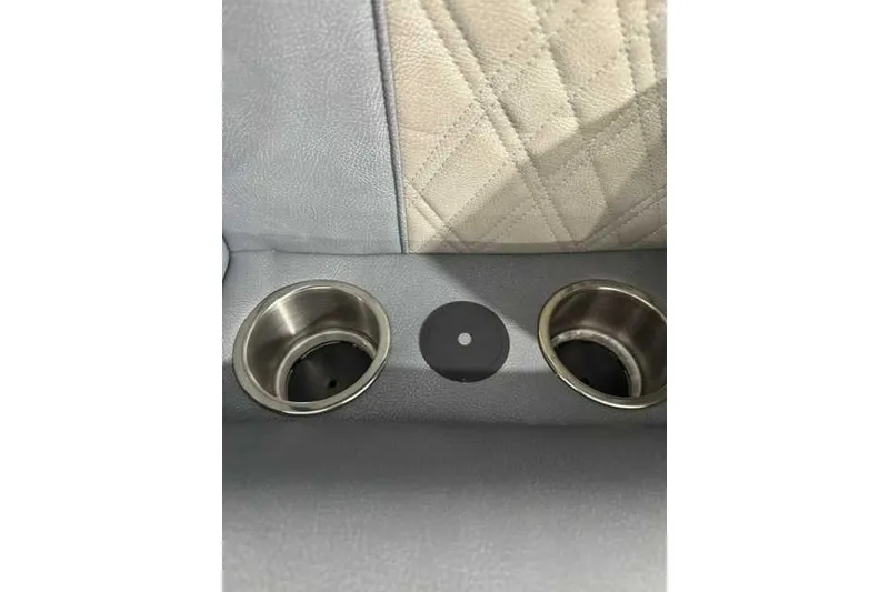 Slide: The Image of 2024 Premier 250 Intrigue RL cup holders and quilted seat detail. - 9