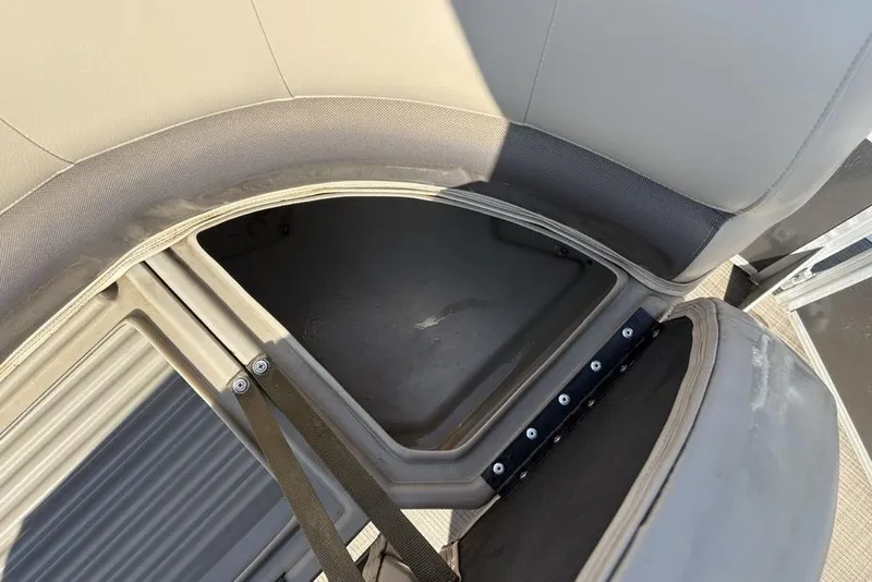 Slide: The Image of Open storage compartment on 2021 Sun Tracker Party Barge® 18 DLX pontoon boat. - 10