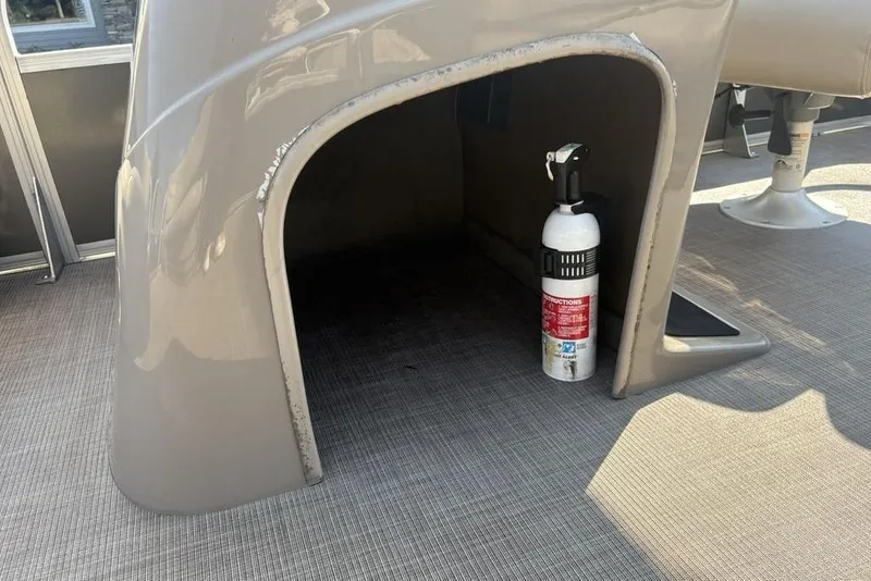 Slide: The Image of 2021 Sun Tracker Party Barge® 18 DLX with fire extinguisher stored under seat. - 11