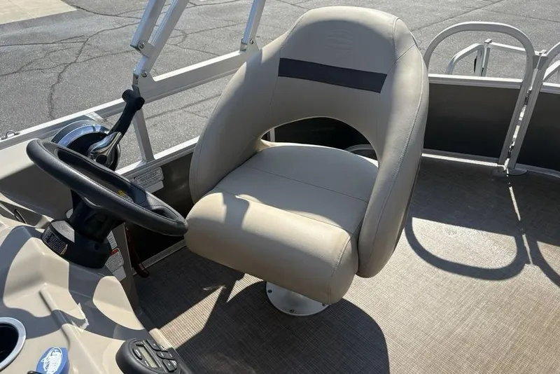Slide: The Image of 2021 Sun Tracker Party Barge® 18 DLX captain's chair and steering wheel. - 18