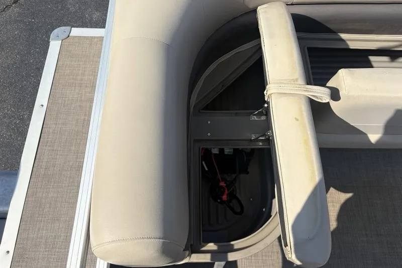 Slide: The Image of 2021 Sun Tracker Party Barge® 18 DLX seating with storage compartment open. - 22