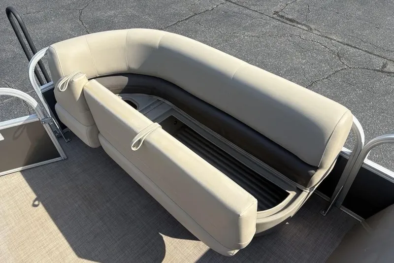 Slide: The Image of 2021 Sun Tracker Party Barge® 18 DLX seating with storage compartment open. - 8