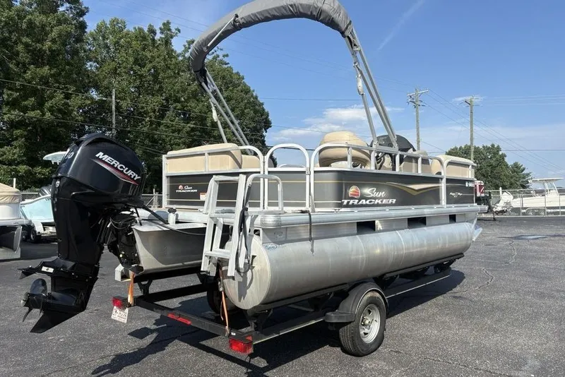 Slide: The Image of 2021 Sun Tracker Party Barge® 18 DLX pontoon boat on trailer with Mercury outboard motor. - 9