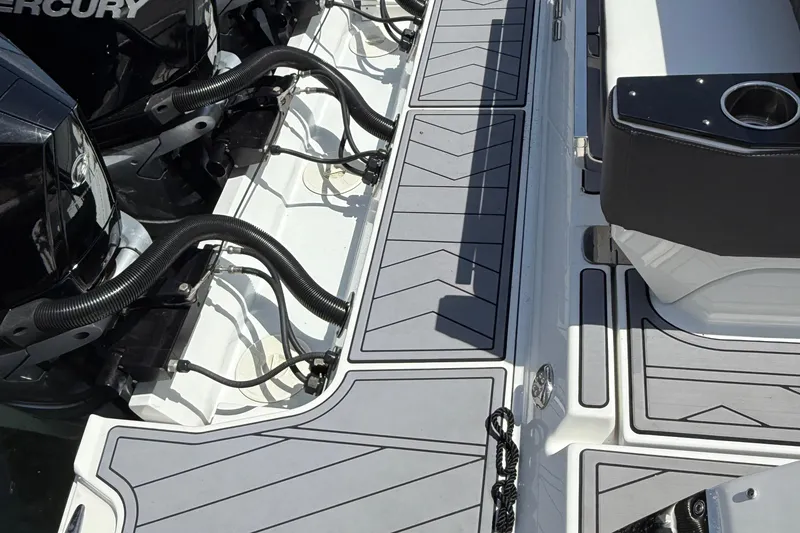 Slide: The Image of 2023 Monterey 385 Super Sport boat deck with Mercury engines and sleek seating. - 14