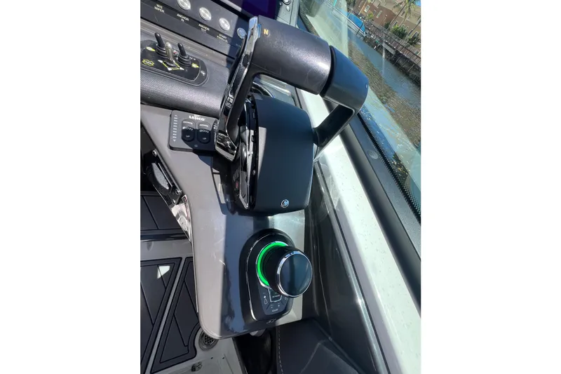 Slide: The Image of Control panel of 2023 Monterey 385 Super Sport boat with throttle and joystick. - 19