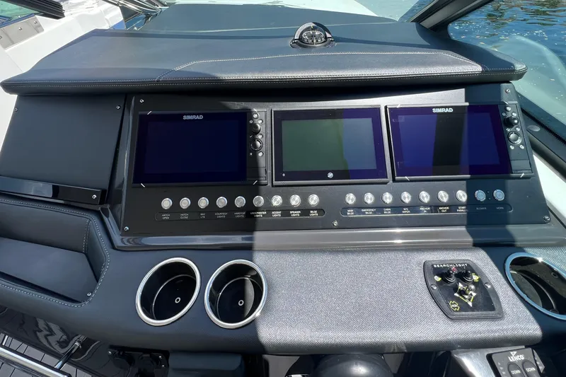 Slide: The Image of 2023 Monterey 385 Super Sport dashboard with Simrad displays and control panel. - 20