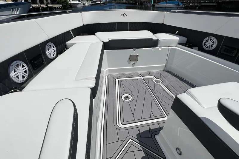 Slide: The Image of 2023 Monterey 385 Super Sport boat interior with sleek seating and modern design. - 22