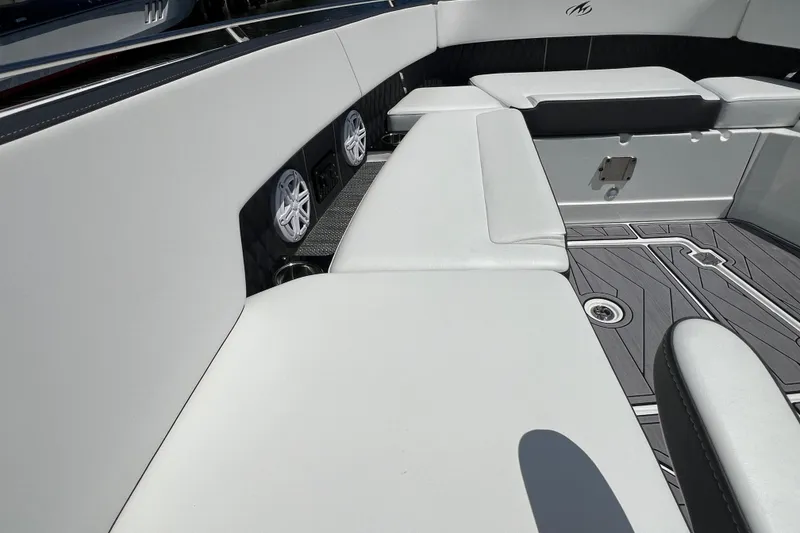 Slide: The Image of 2023 Monterey 385 Super Sport boat interior with white seating and modern design. - 23