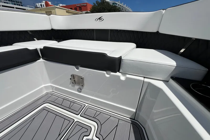 Slide: The Image of 2023 Monterey 385 Super Sport boat interior with white seating and sleek flooring. - 27