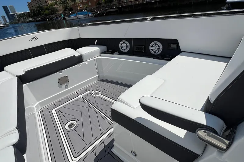 Slide: The Image of 2023 Monterey 385 Super Sport boat interior with sleek seating and modern design. - 28