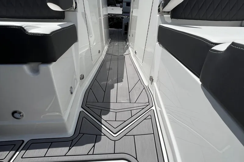 Slide: The Image of 2023 Monterey 385 Super Sport boat interior with sleek seating and modern flooring design. - 29