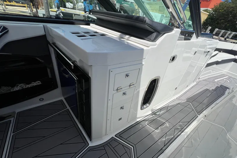 Slide: The Image of 2023 Monterey 385 Super Sport boat interior with sleek cabinetry and modern design. - 32
