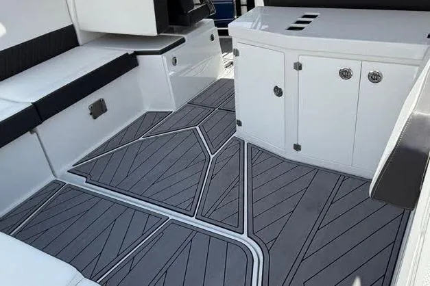 Slide: The Image of 2023 Monterey 385 Super Sport boat interior with sleek seating and modern flooring design. - 33