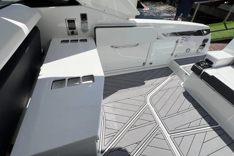Slide: The Image of 2023 Monterey 385 Super Sport boat interior with sleek design and modern flooring. - 34