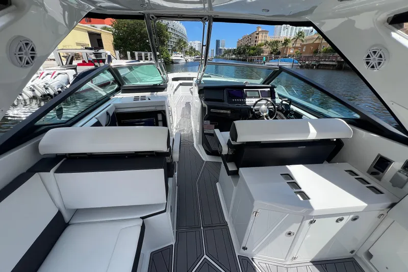 Slide: The Image of 2023 Monterey 385 Super Sport boat interior with sleek seating and modern dashboard. - 39