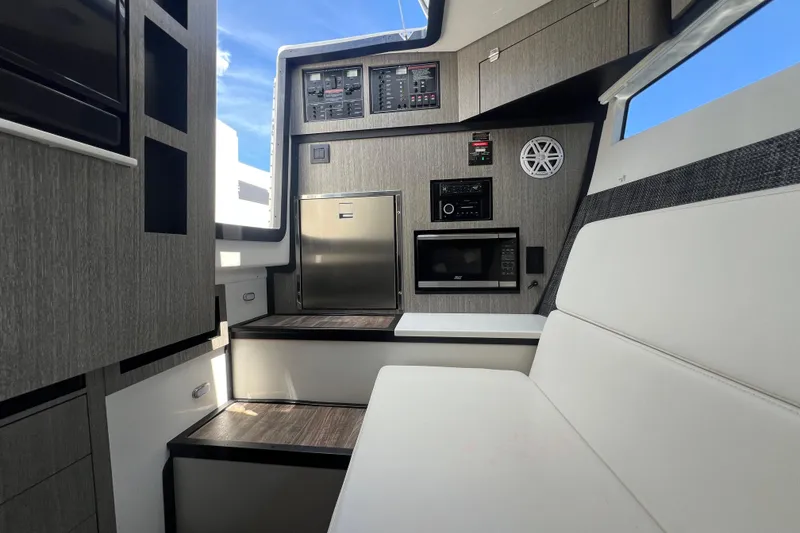 Slide: The Image of Interior of 2023 Monterey 385 Super Sport boat with modern amenities and sleek design. - 42