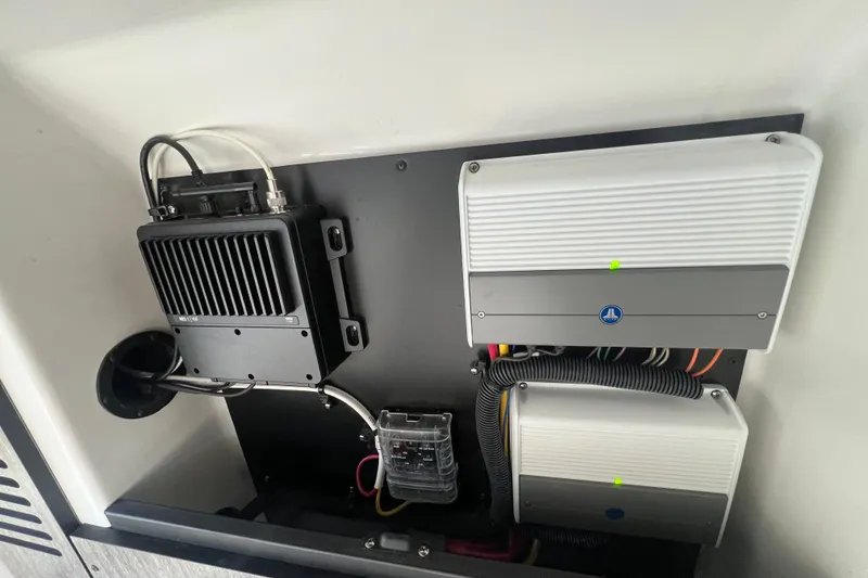 Slide: The Image of Electrical components inside a 2023 Monterey 385 Super Sport boat. - 49