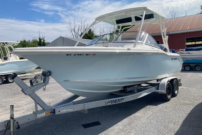 The Image of 2022 Key West 239 DFS boat on trailer, parked outdoors. - 0