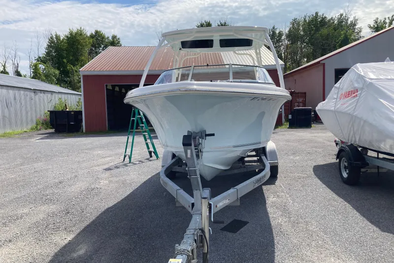 Slide: The Image of 2022 Key West 239 DFS boat on trailer in outdoor storage area. - 2