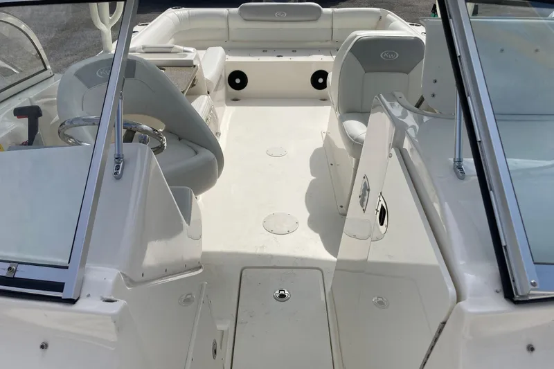 Slide: The Image of 2022 Key West 239 DFS boat interior with seating and steering wheel. - 24