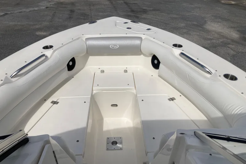 Slide: The Image of 2022 Key West 239 DFS boat interior with white seating and storage compartments. - 25