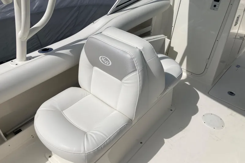 Slide: The Image of White leather seat on 2022 Key West 239 DFS boat deck. - 9