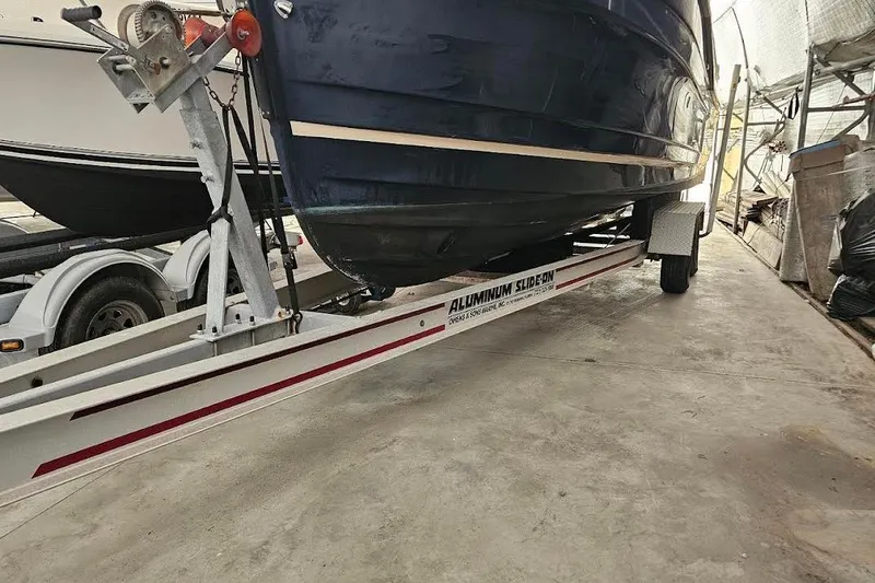 Slide: The Image of 2016 Ranger Tugs R25 SC boat on an aluminum trailer in a storage area. - 3