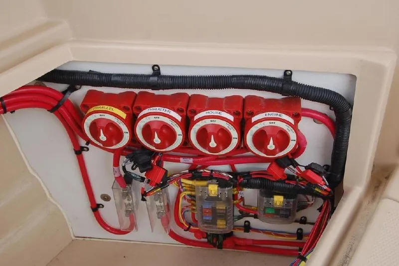 Slide: The Image of Electrical panel of 2016 Ranger Tugs R25 SC with red switches and wiring. - 6