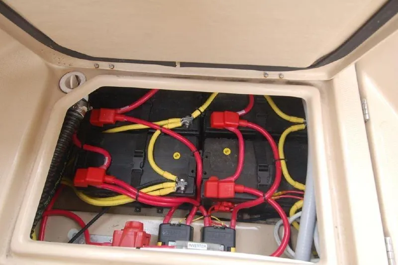 Slide: The Image of 2016 Ranger Tugs R25 SC battery compartment with red and yellow cables. - 7