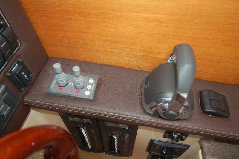 Slide: The Image of 2016 Ranger Tugs R25 SC boat controls with dual joysticks and throttle lever. - 9