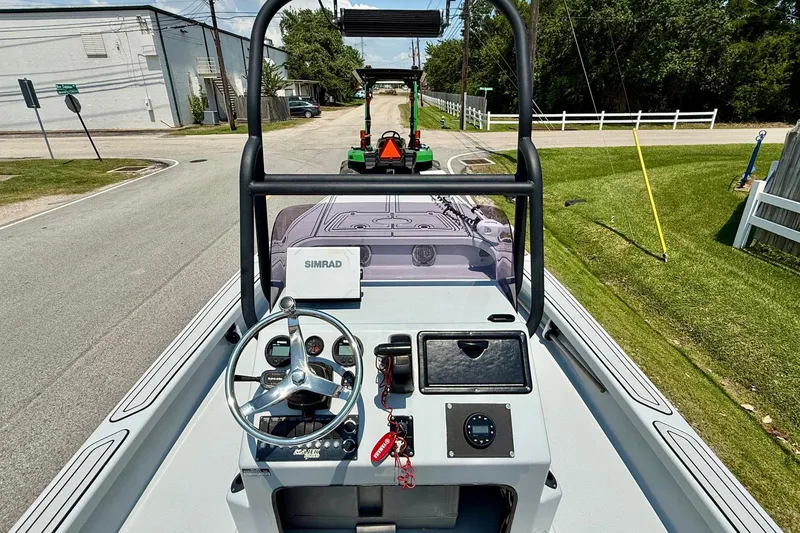 Slide: The Image of 2017 Majek M2 ILLUSION boat dashboard with steering wheel and Simrad navigation system. - 10