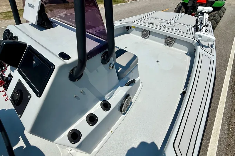 Slide: The Image of 2017 Majek M2 ILLUSION boat interior with console and seating, featuring Simrad electronics. - 13
